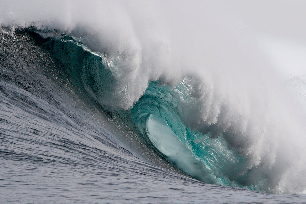 Large wave with white foam double cresting in the ocean